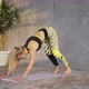 Female Coach Yoga Practicing Yoga in Loft Studio - VideoHive Item for Sale