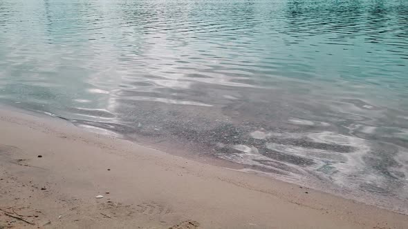 Sea Waves Lapping Against Shore