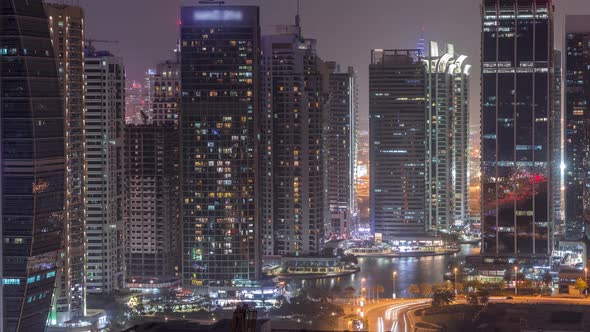 Residential and Office Buildings in Jumeirah Lake Towers District Night Timelapse in Dubai