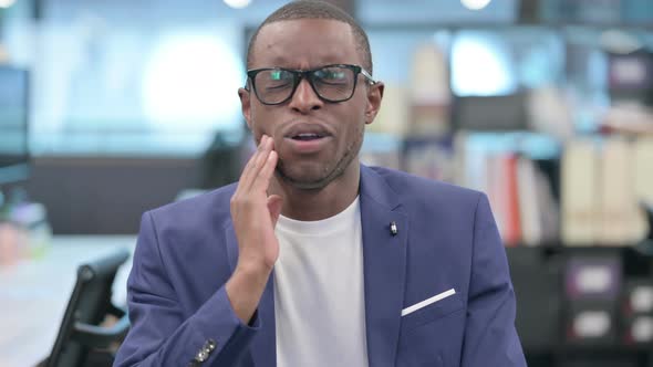 Portrait of African Businessman Having Toothache Cavity