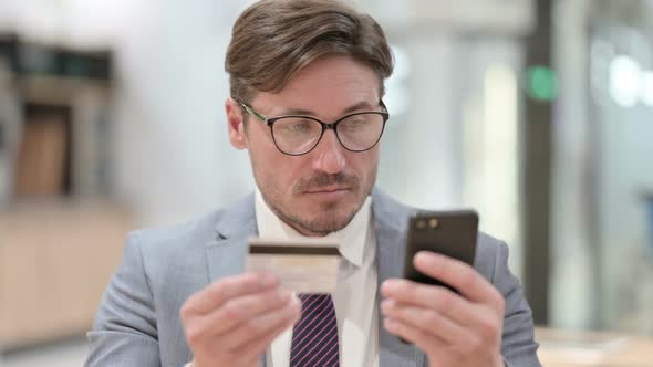 Portrait of Online Payment Failure on Smartphone By Businessman