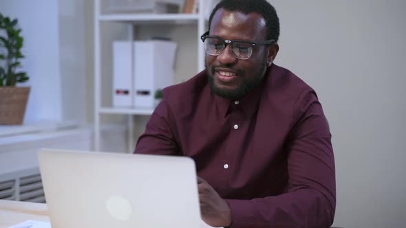 Man Wave at Laptop Webcam When Having Video Call