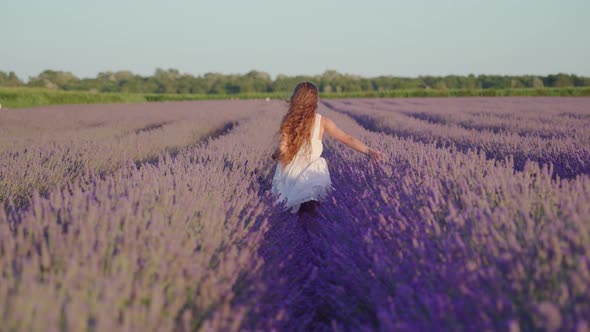 Girl Runs Between Lavender Fields