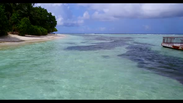 Aerial drone panorama of marine seashore beach trip by blue ocean and white sand background of a day