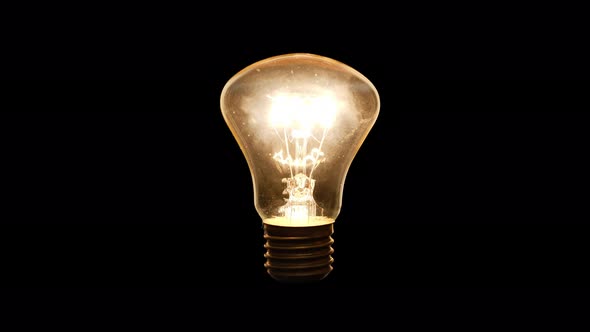 4K - Lights up incandescent light bulb