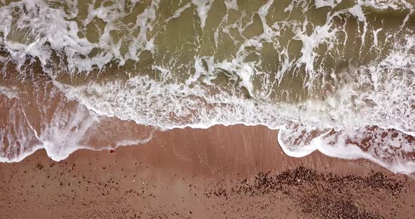 Top Down View of Waves Breaking in the Sand, Flying Over Tropical Sandy Beach and Waves