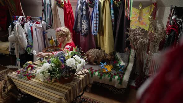 Wide Shot Traditional Ukrainian Clothes Indoors with Talented Craft Person Making Head Wreath in