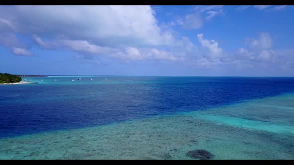 Aerial flying over scenery of beautiful sea view beach adventure by shallow ocean with white sand ba