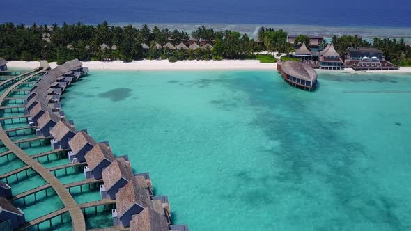 Aerial drone panorama of bay beach journey by blue ocean with sand background