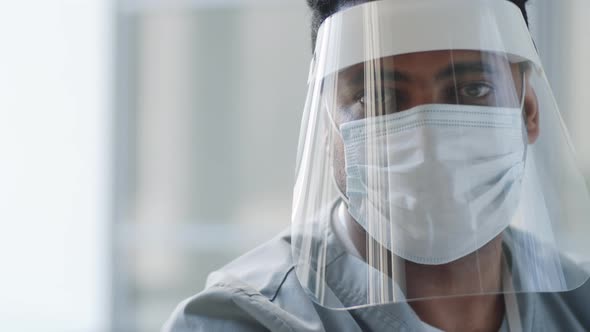 Portrait of Doctor in Face Shield and Mask at Work