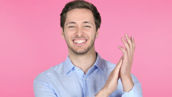 Applauding, Young Man Clapping on Pink Background