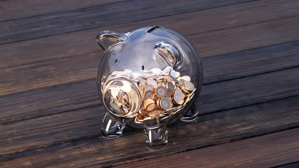 Cute glass piggy bank with huge amounts of coins. Money fast grows inside.