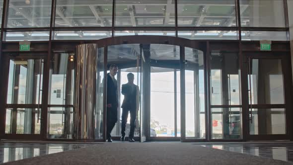 Business People Entering Office Building