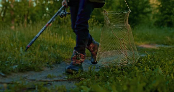 Child Fisher with Tackle is Walking in Early Morning Closeup View of Legs  Prores