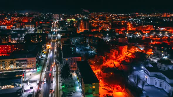 Hyperlapse of Car Traffic on Road Passing Through Town at Winter Night