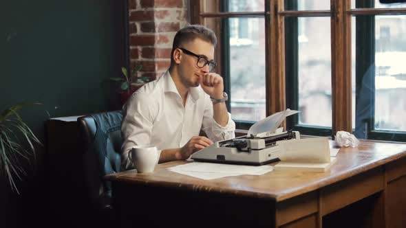 Writer Having Coffee As Typing