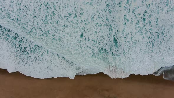 Seascape with Ocean Waves Rolling on Empty Beach Upper View