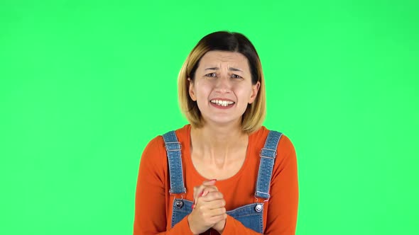 Cute Female Looking at the Camera with Excitement, Then Celebrating Her Victory Triumph. Green