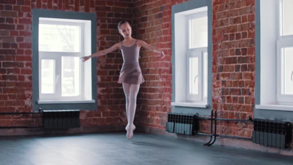 A Little Ballerina Girl Performing Basic Dancing in the Studio