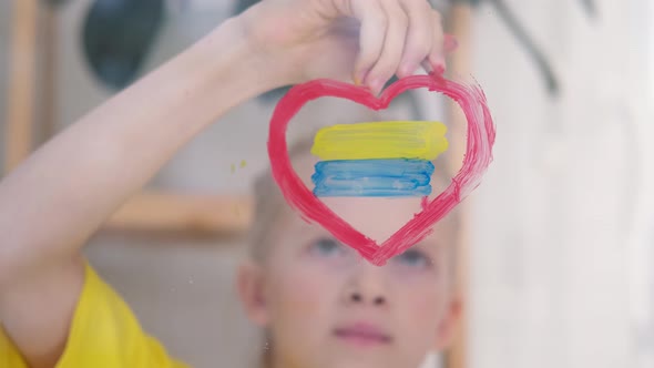 Girl Painting Flag of Ukraine on the Window Upset and Survives the War Ukraine Russia