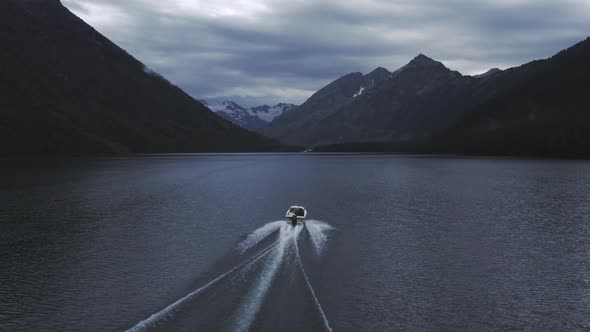 Motorboat on Multin lakes in the middle of mountains in Altai