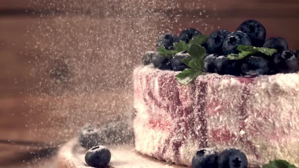 Super Slow Motion Powdered Sugar Falls on the Blueberry Cake