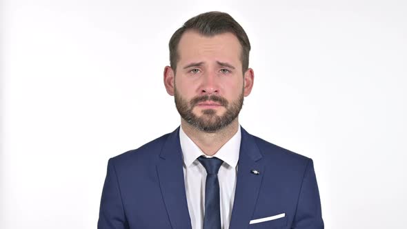 Upset Businessman Crying at the Camera, White Background