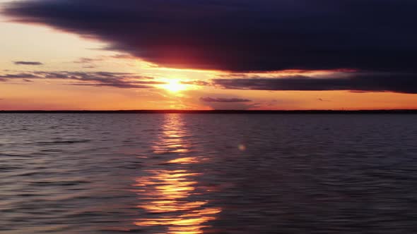 The Sun Reflects on the Dark Sea. Horizontal Panorama Over the Sunset Sea