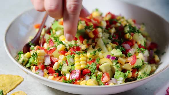 Mexican corn salad in white plate. 