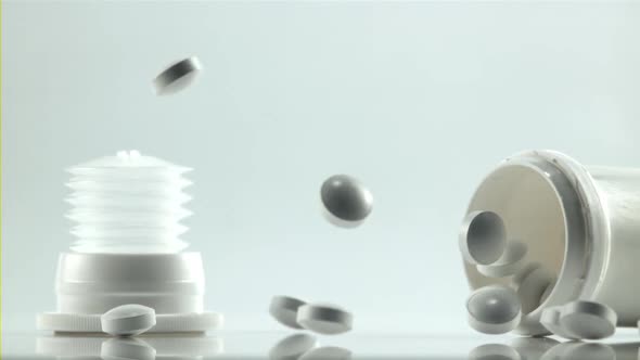 A Jar of Pills Falls on the Table