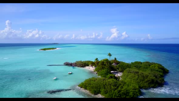 Aerial flying over tourism of beautiful seashore beach holiday by blue green ocean and white sand ba