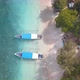 Traditional Indonesian wooden boats, moored on tropical island beach, aerial - VideoHive Item for Sale