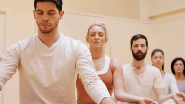 Group of people doing meditation