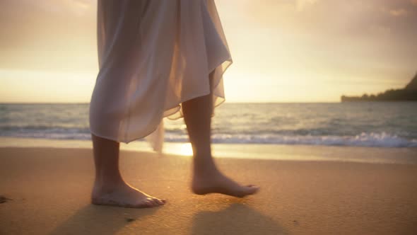 Close Up Girl in Romantic White Boho Wedding Dress Walking Barefoot Ocean Beach