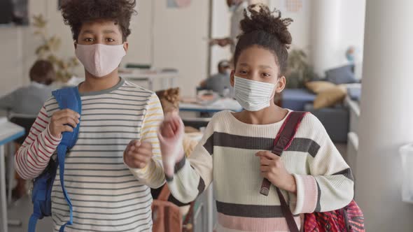 Afro-American Teenage Siblings in Class during Covid19