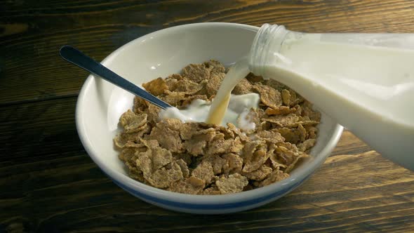 Milk Poured On Breakfast Cereal