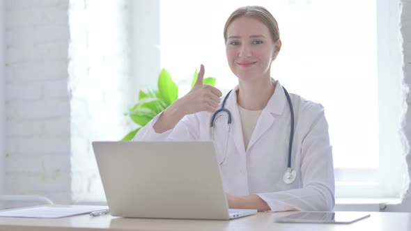 Lady Doctor Showing Thumbs Up While Sitting in Clinic