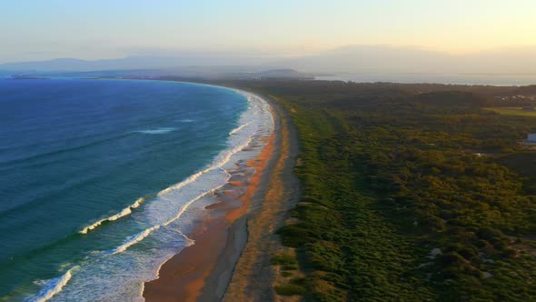 Fast-moving Aerial view of Scenic Wild Natural Beach - Port Kembla near Wollongong, NSW Australia