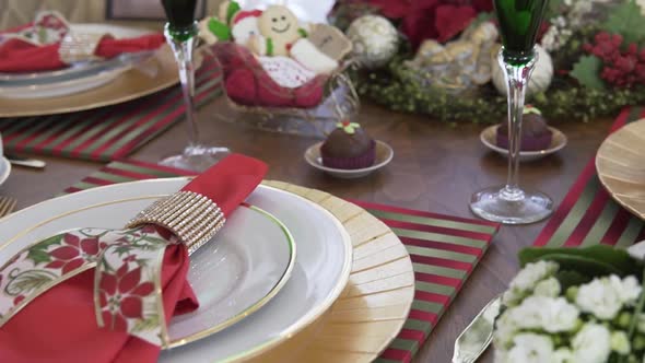close up shot from left to right of a beautiful christmas dinner table modern decoration