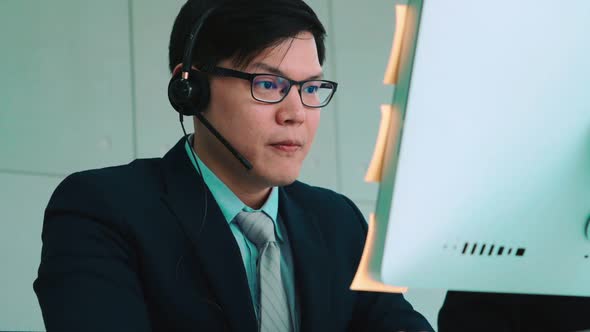 Business People Wearing Headset Working in Office