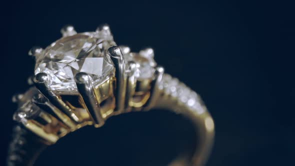 Extreme Detailed of Diamond Ring Close Up Shot While Rotating on Dark Background