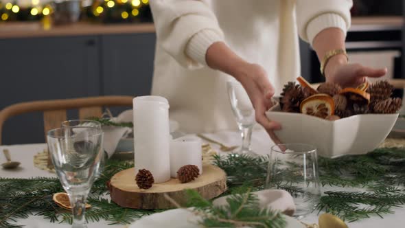 Close up of women preparing table for Christmas Eve. Shot with RED helium camera in 8K