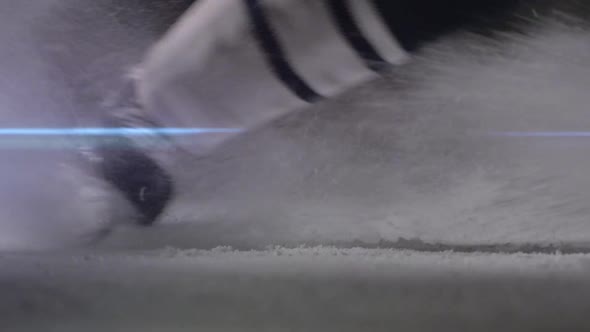 Ice Hockey Player Make Ice Sparkles on High Speed Braking