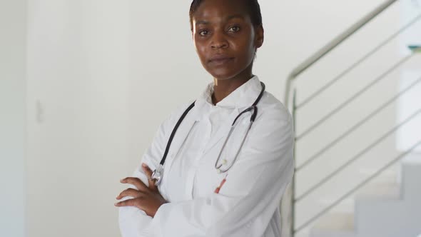 Portrait of african american female doctor looking to camera smiling