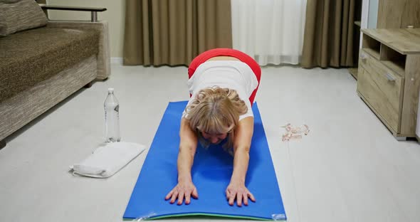 Senior Woman Stretching on Floor