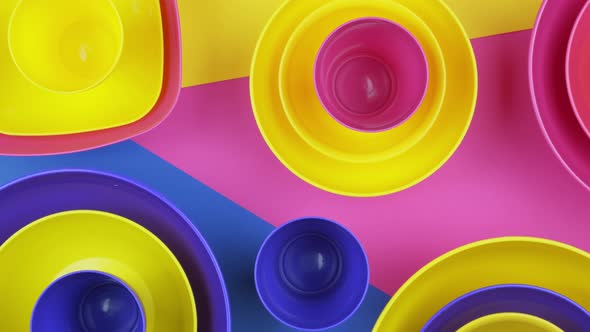 Pink Blue Yellow Colorful Plastic Water Bowls Futuristic Color Design.  Footage