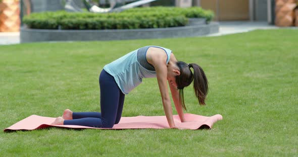 Woman do yoga at the park