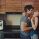 Offering Coffee to Husband in the Kitchen in the Morning - VideoHive Item for Sale