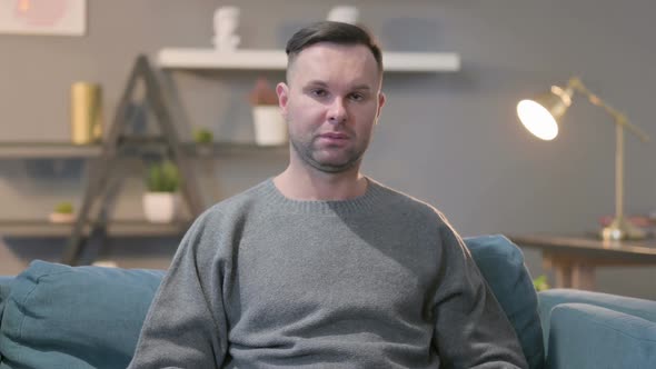 Portrait of Casual Man Feeling Sad Towards the Camera