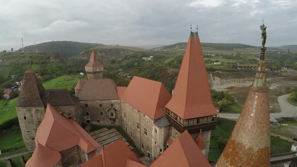 Aerial view of Corvin Castles rooftops and towers